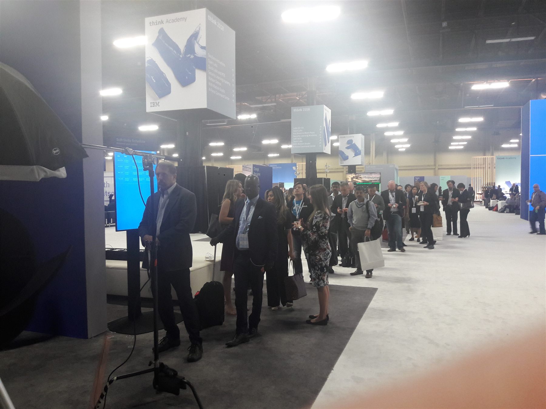 Professionals lined up at a trade show booth headshot lounge, Las Vegas